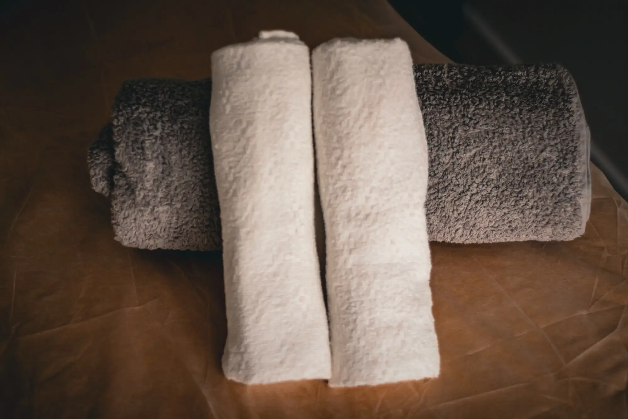 Rolled towels on the massage table